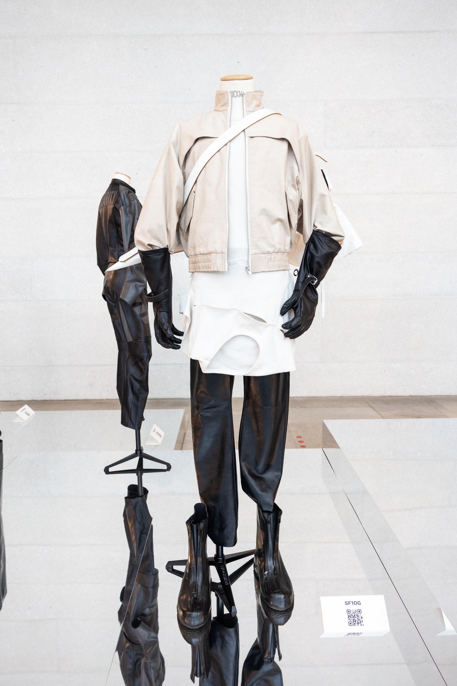Image may contain Clothing Glove Adult Person and Coat
